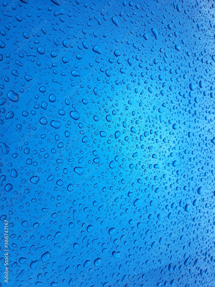 Close up texture water droplets raindrop on beautiful blue metallic background image for abstract background. Close up texture water droplets raindrop on beautiful blue metallic background image for abstract background.