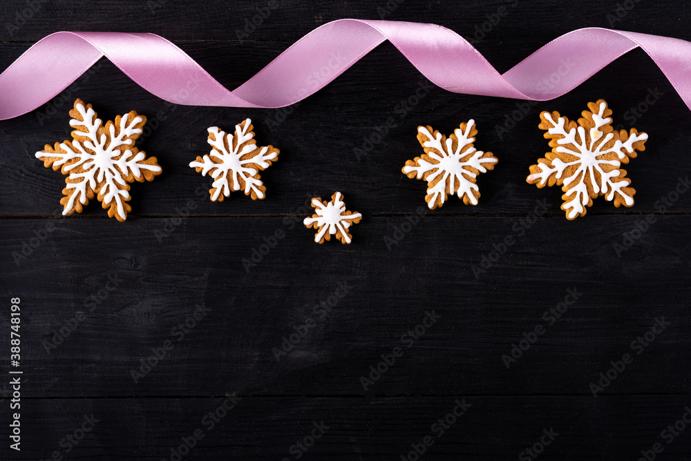 Gingerbread cookies on a black table top view with copy space. Gingerbread cookies on a black table top view with copy space.