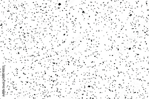 Grunge mottled texture. Monochrome background of small noise with rare particles, inclusions, debris and graininess. Overlay template. Vector illustration