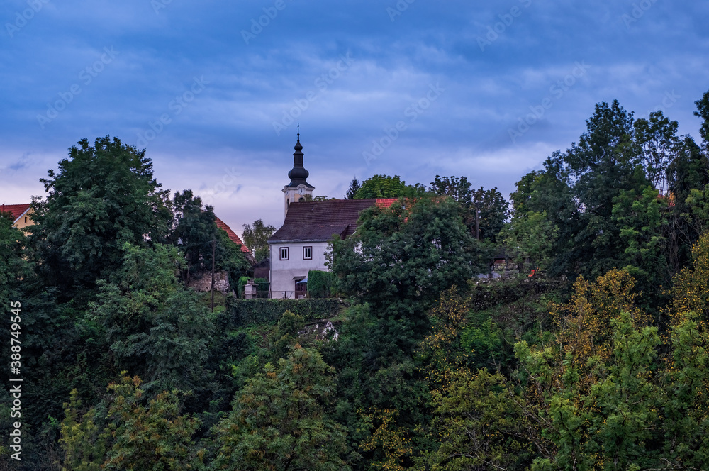 RASTOKE, CROATIA - AUG 21, 2020: Church in new part of Rastoke village, the historic center of the Croatian municipality of Slunj. This old part of Slunj is known for its well-preserved mills.