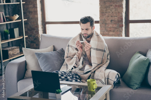 Konstfotografi Photo of sick ill dizzy guy sit divan check thermometer measure temperature have