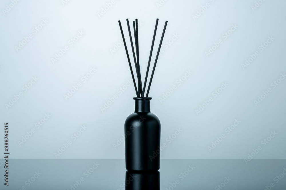 Fototapeta premium Luxury black glass bottle of home scent