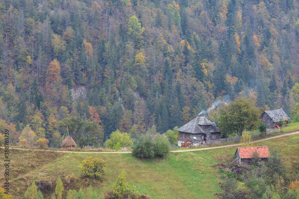 Autumn rural scene of the Romanian village  in Transylvania, at the foot of the Carpathian Mountains