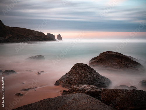 Beautiful sunset on Robayera beach in Miengo, Cantabria. Long exposure seascape in northern Spain.