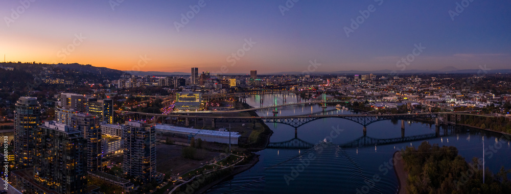 Fototapeta premium South Portland Oregon on the Waterfront looking towards Downtown with Drone at Sunset