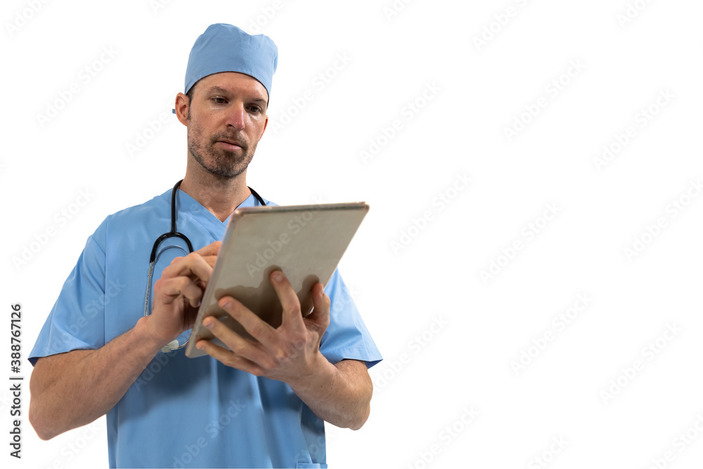 Male surgeon using digital tablet against white background Male surgeon using digital tablet against white background