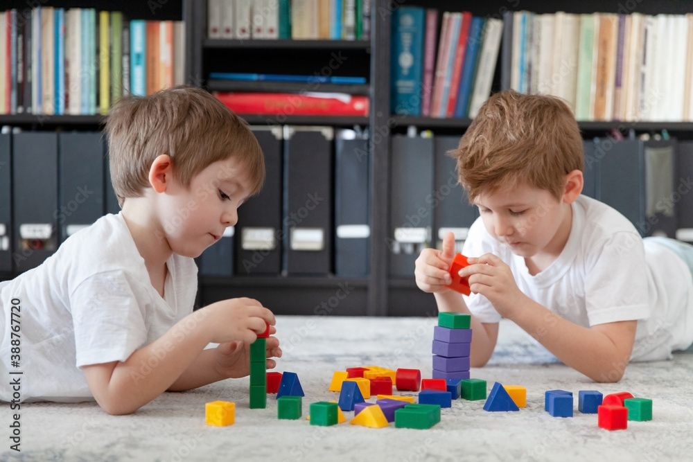 Two little Caucasian boy playing with
wooden toy Montessori materials. Kids learn geometry. Educational toys, Cognitive skills, Montessori activity, sensory play. Montessori educational method. Two little Caucasian boy playing with
wooden toy Montessori materials. Kids learn geometry. Educational toys, Cognitive skills, Montessori activity, sensory play. Montessori educational method.