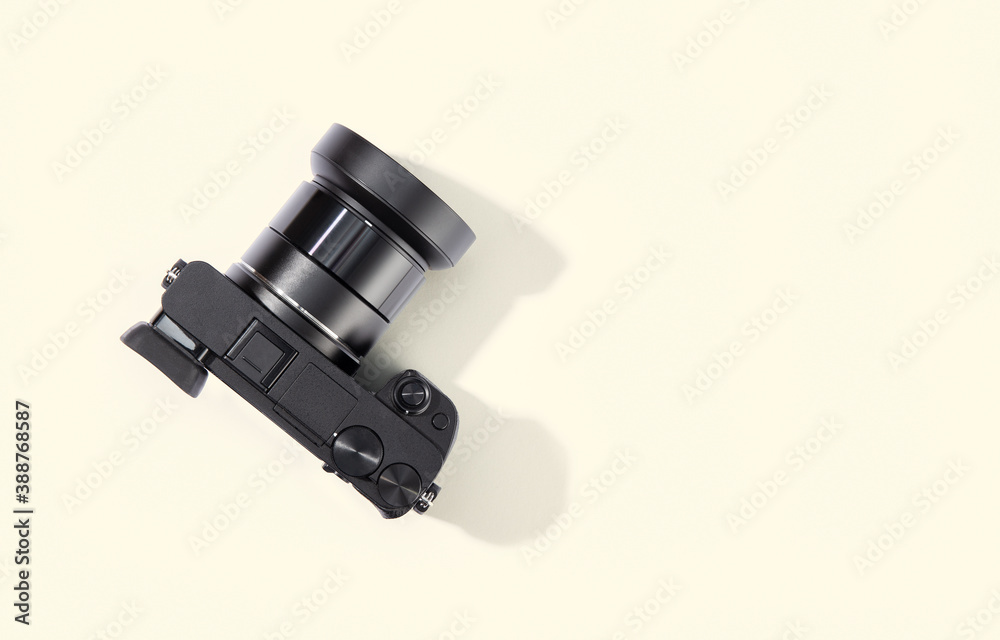 Top view of digital camera isolated on beige background. Top view of digital camera isolated on beige background.
