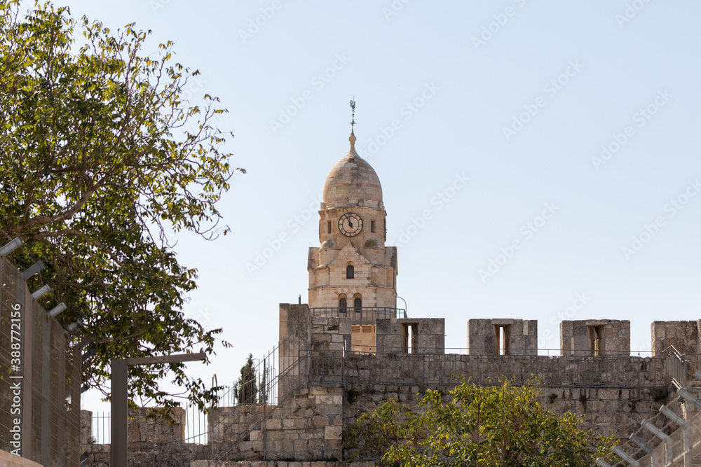 The city  wall and the upper part of the Franciscan monastery near the Armenian quarter in the old city of Jerusalem, Israel