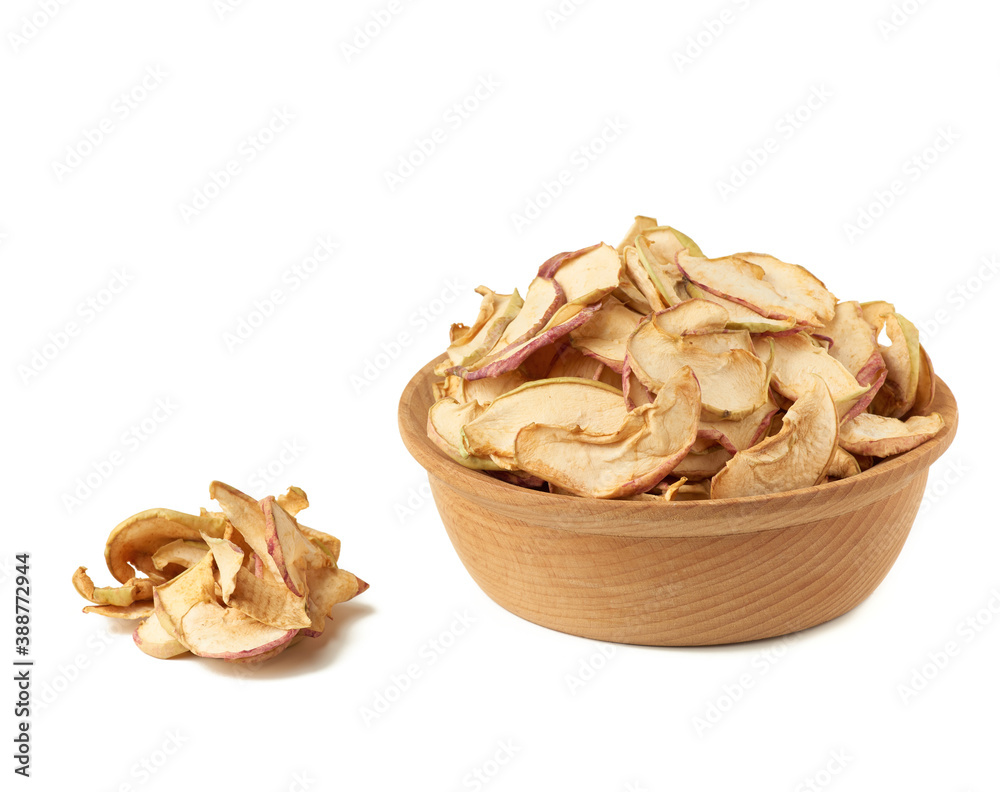 dried apple slices in wooden plate isolated on white background