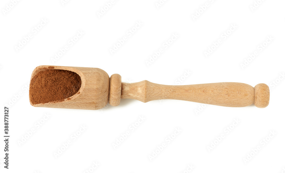 brown ground cinnamon in a wooden spoon brown ground cinnamon in a wooden spoon