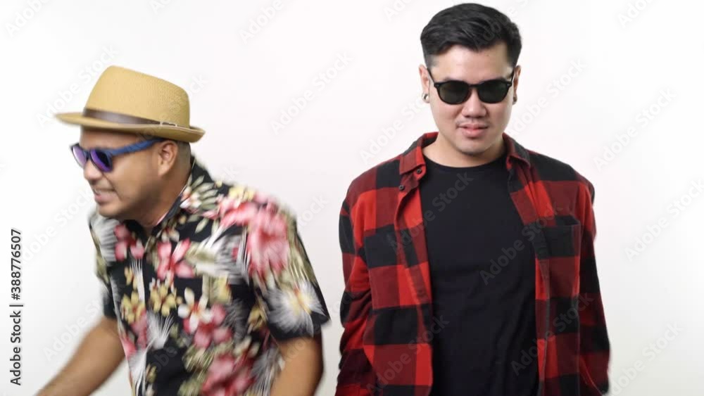 Crazy Two man are friend put on hat and glasses dancing on isolated background. 4K Resolution. Crazy Two man are friend put on hat and glasses dancing on isolated background. 4K Resolution.