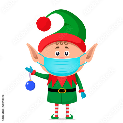 little elf in a medical mask and surgical gloves holds a New Year's ball in his hand.