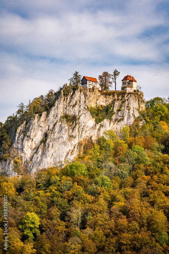 Colorful view of Bronnen Castle on the hiking trail in autumn in the Danube valley near Beuron