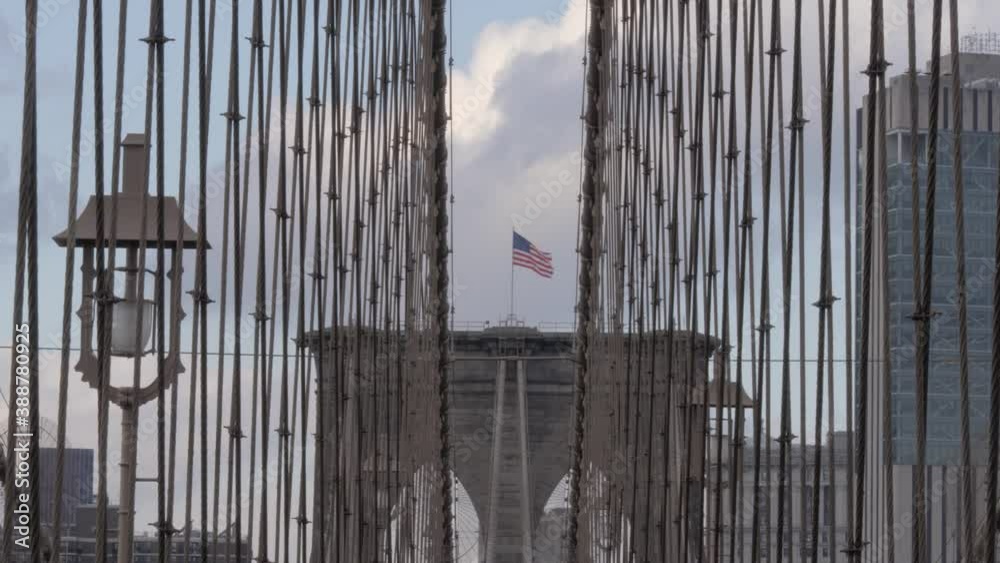 American flag waving on top of Brooklyn Bridge. American flag waving on top of Brooklyn Bridge.