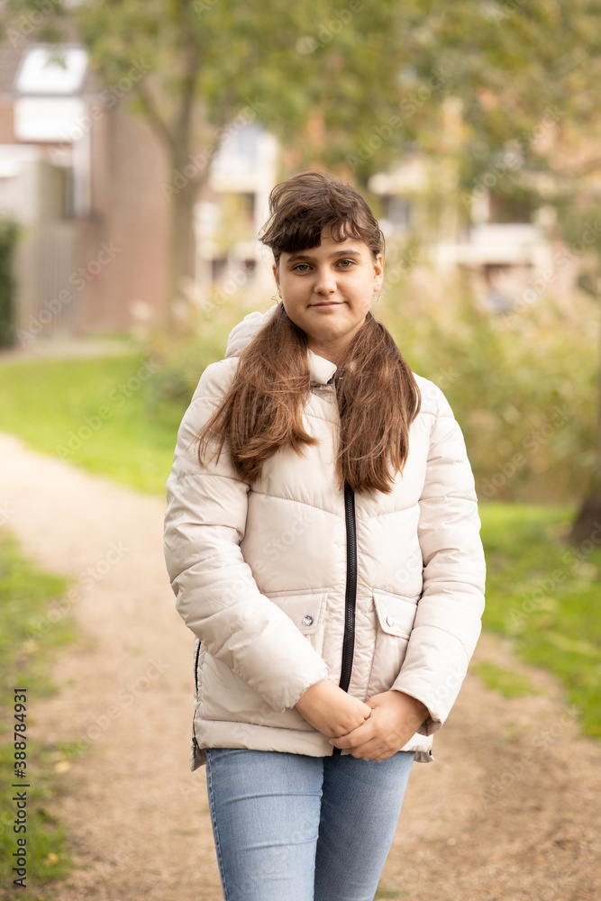 Close up portrait of caucasian smiling girl outside in park, autumn time Close up portrait of caucasian smiling girl outside in park, autumn time