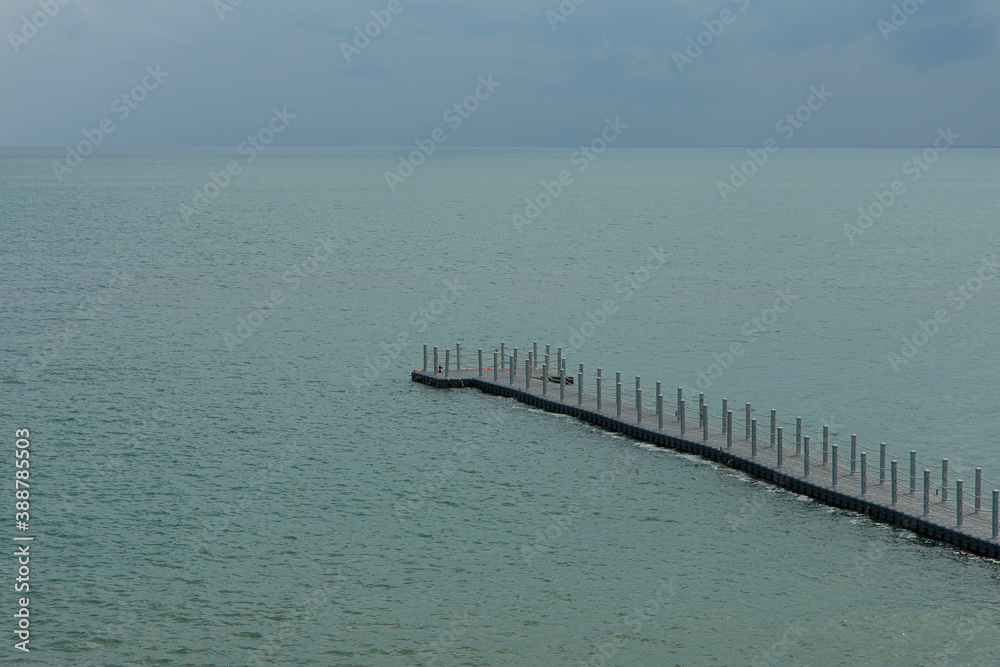 Fototapeta premium The buoy walkway extends into the sea.