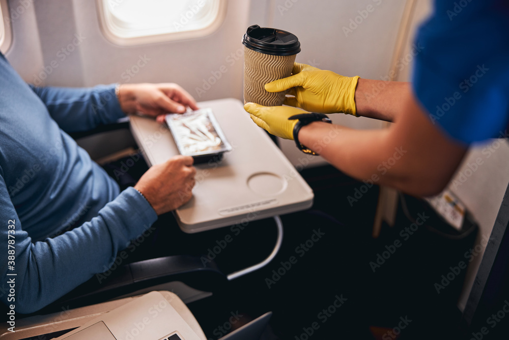 Coffee served to a passenger on the plane