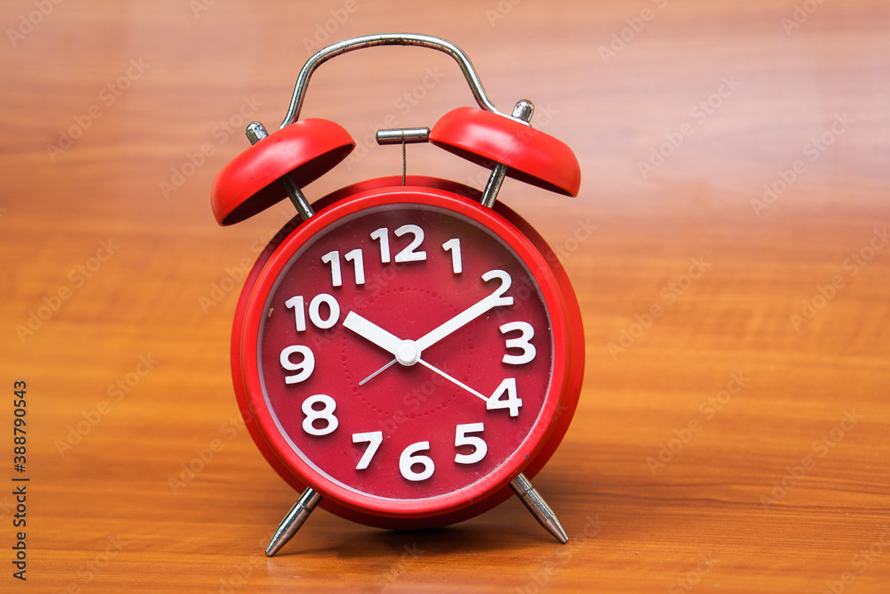 red clock on wooden background, copy spaсe. red clock on wooden background, copy spaсe.