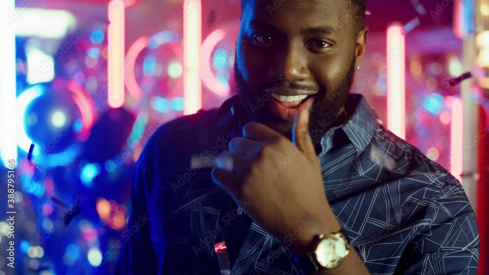 Affectionate Man Winking In Club Guy Calling Somebody With Gesture At affectionate-man-winking-in-club-guy-calling-somebody-with-gesture-at