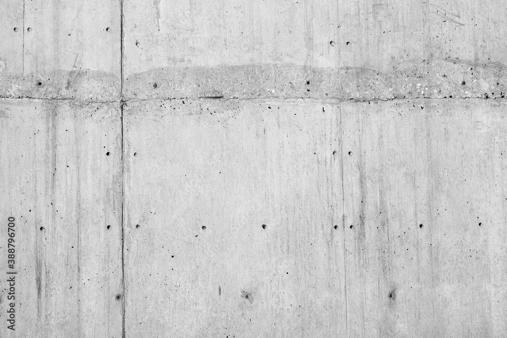 Concrete wall background in black and white. Grey concrete wall surface. Concrete wall background in black and white. Grey concrete wall surface.