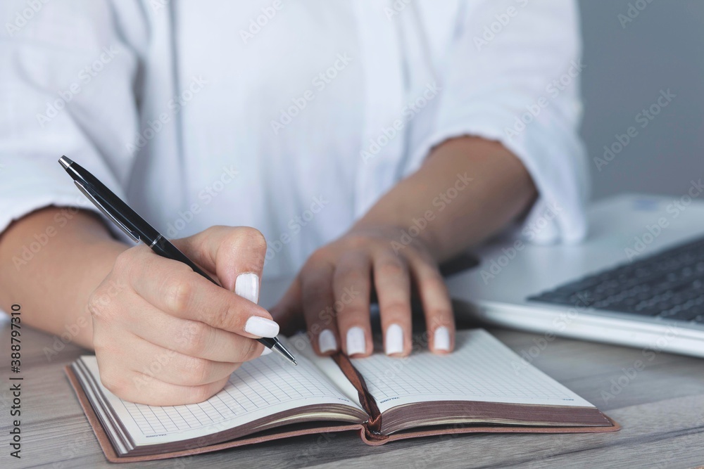 woman hand pen with notepad woman hand pen with notepad