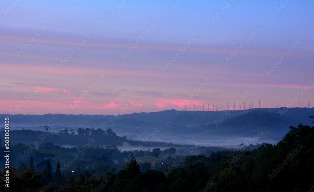 Beautiful Landscape of mountain layer in morning sun ray and winter fog Beautiful Landscape of mountain layer in morning sun ray and winter fog
