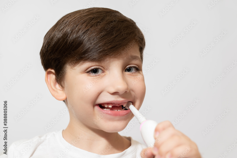 Cute little boy brushing teeth, isolated on white Cute little boy brushing teeth, isolated on white