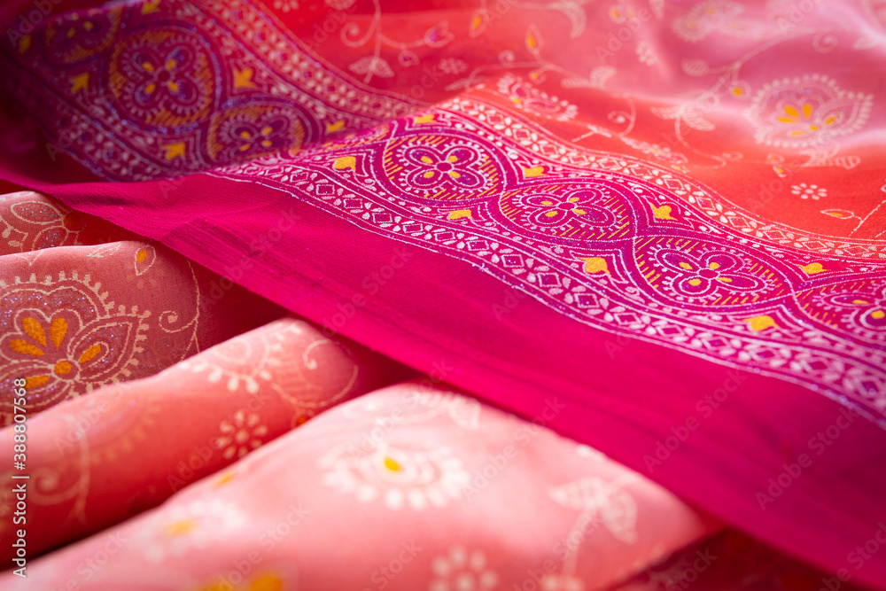 Red fabric in floral pattern as a background Red fabric in floral pattern as a background