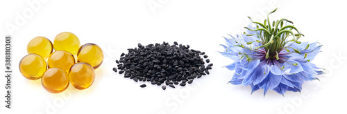 Black cumin capsules oil. Black cumin seeds. Nigella sativa flower.