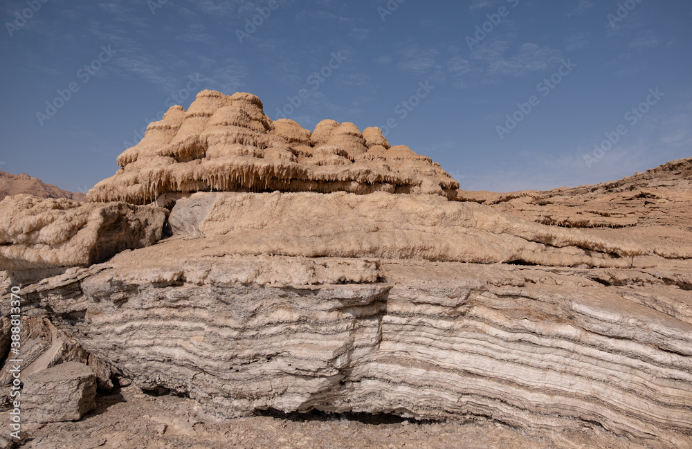 Bizarre salt deposits in the western Dead Sea coast, Earth's lowest elevation on land, Israel. Unique coastline, natural salt formations and patterns, salt stalagmites in the Dead Sea shore.