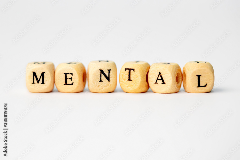 The word mental in wooden cube letters on white background isolated white background The word mental in wooden cube letters on white background isolated white background