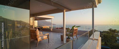 Luxury home showcase exterior patio with sunset ocean view