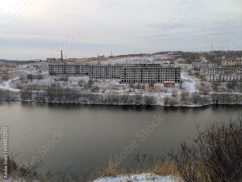 warm autumn early winter on the river Bank view of the old village Vorkuta city