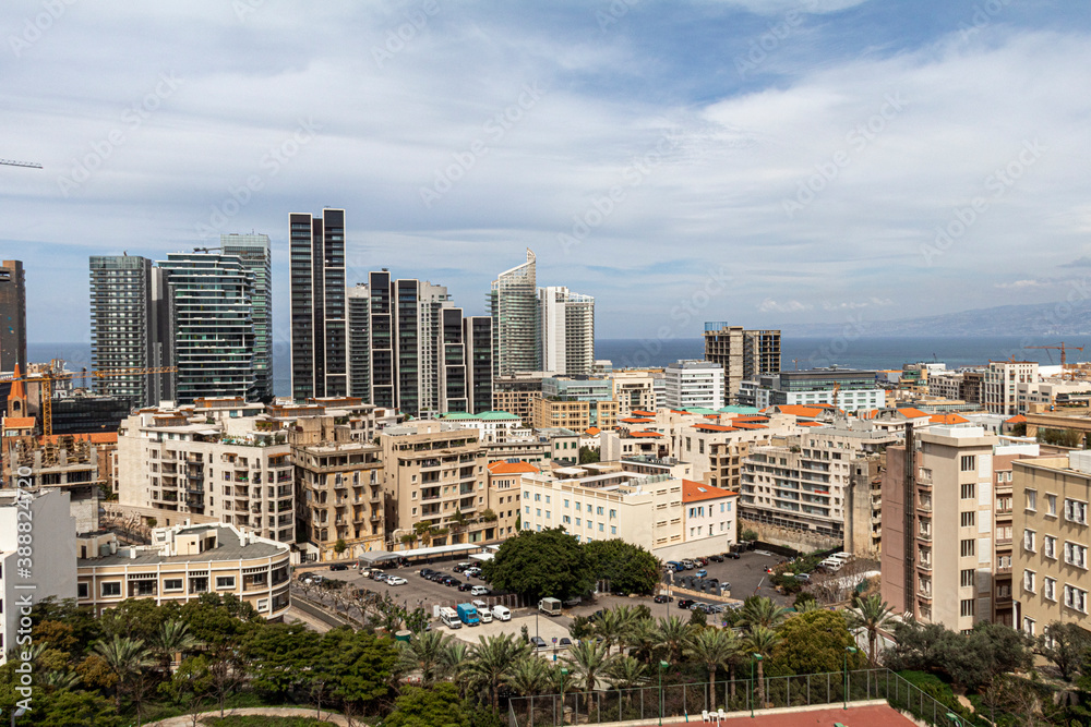 Fototapeta premium Vibrant urban skyline of Beirut, a Mediterranean coastal city featuring modern high-rise buildings, luxury apartments, and commercial towers contrasting with Beirut's classical buildings 