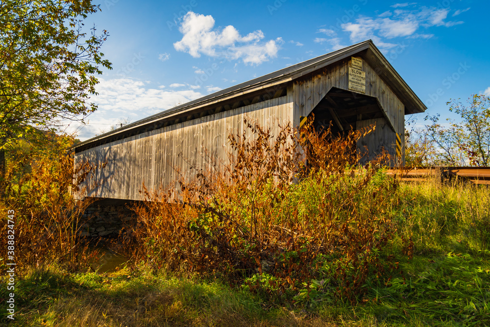 historic New England covered bridge built in the lattice style in the 1890s
historic New England covered bridge built in the lattice style in the 1890s