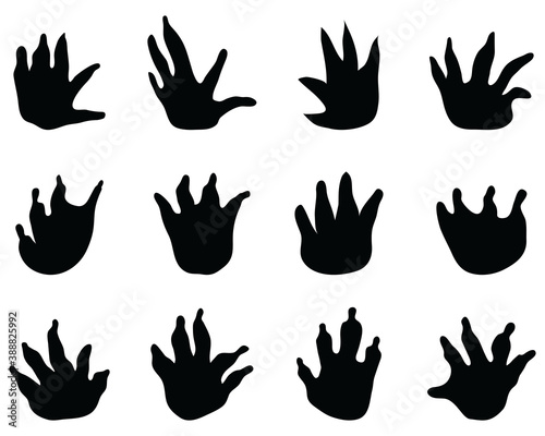 Black footprints of crocodile on a white background