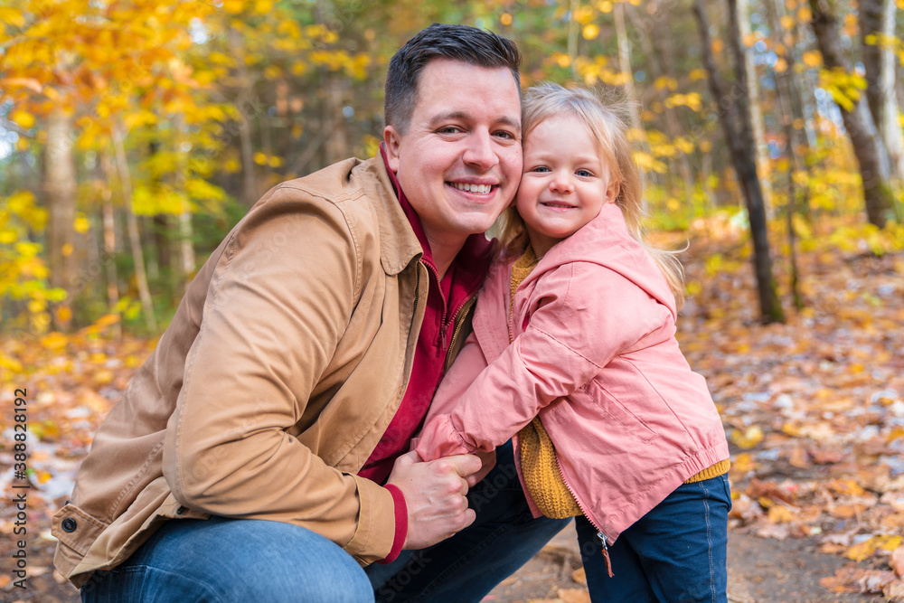 daughter and her father in the autumn season in park daughter and her father in the autumn season in park