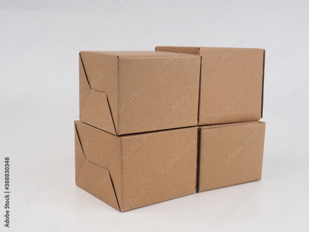 several cardboard boxes. Cardboard Boxes Stacked Against White Background