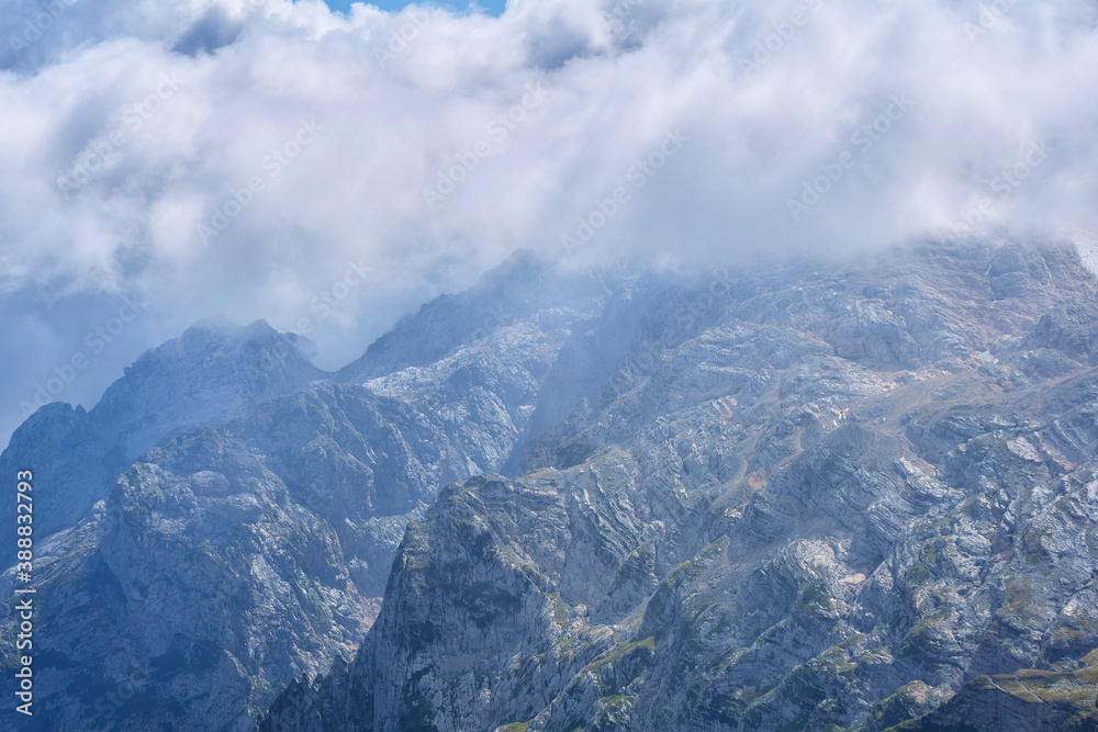 majestic rocky mountain spurs among the clouds