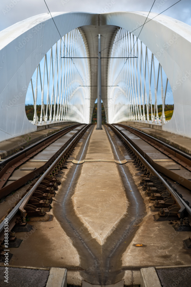 Obraz premium white construction of a transport bridge for cars and trams .modern transport bridge over the Vltava river in the center of the city of Prague in the Czech Republic 30 October 2020
