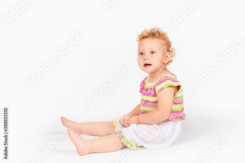 little girl with curly hair on a light background