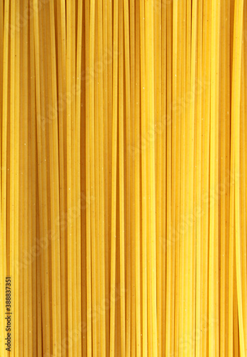 Pasta background, uncooked spaghetti