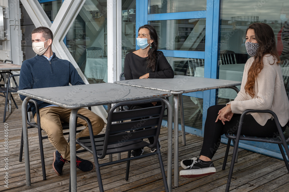 two woman and one man