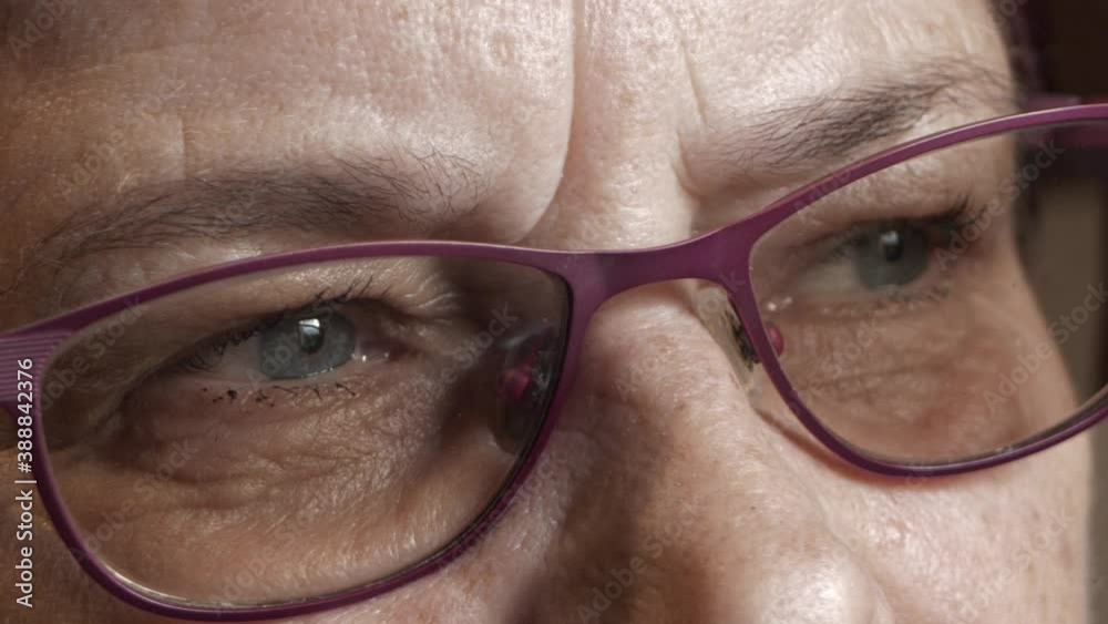 An old woman with glasses says no with her eyes An old woman with glasses says no with her eyes