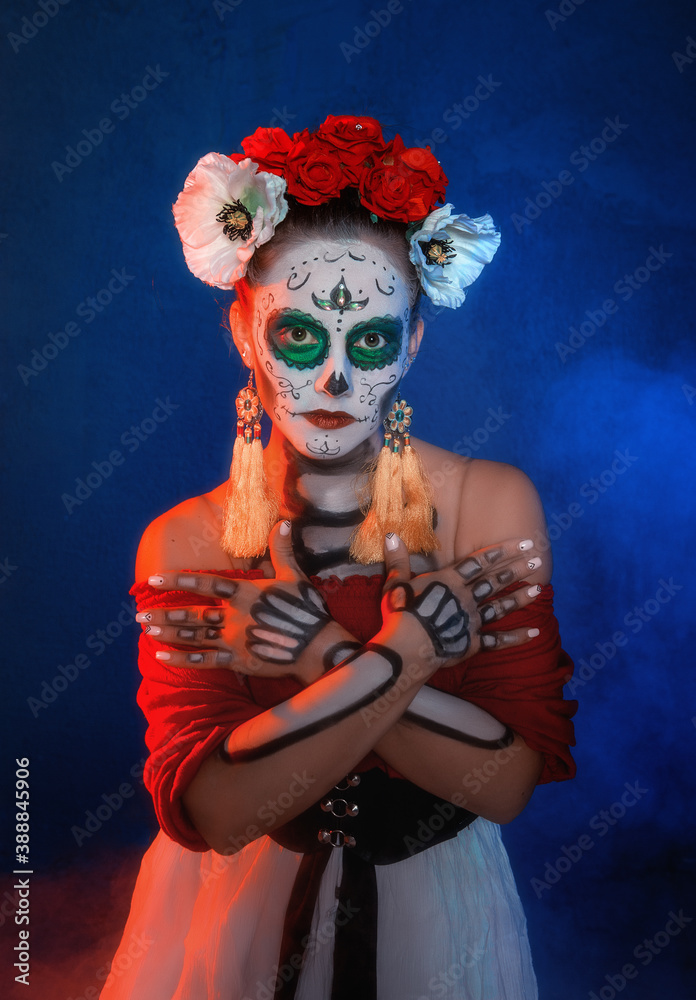 Beautiful woman with scary skull Halloween make up dead day calavera style