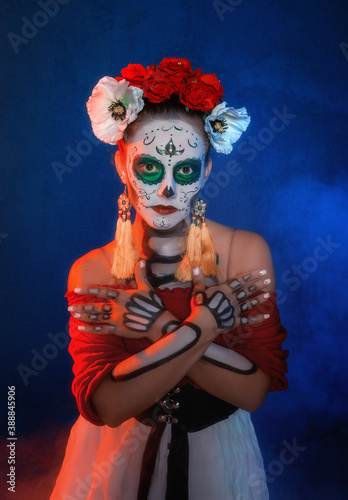 Beautiful woman with scary skull Halloween make up dead day calavera style