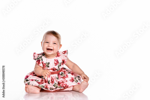 Portrait of a sweet infant girl isolated on white in studio.