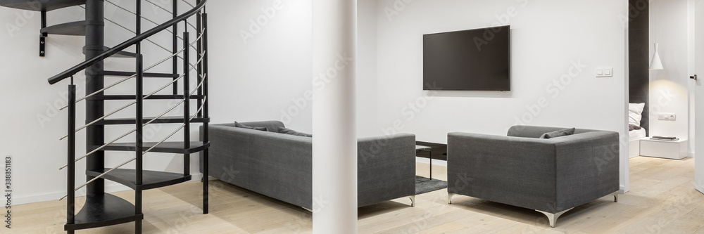 Living room with spiral stairs, panorama Living room with spiral stairs, panorama