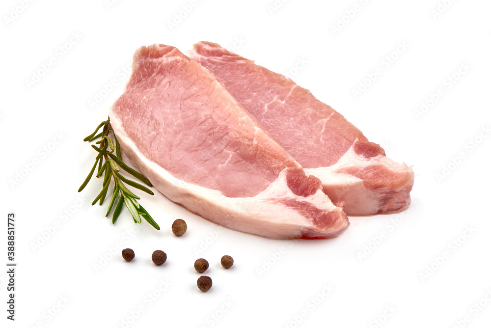 Sliced raw pork steaks, isolated on white background